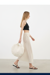 Luxury Beach Wrap Skirt Set in Soft Ivory Sand - Side Walking Pose